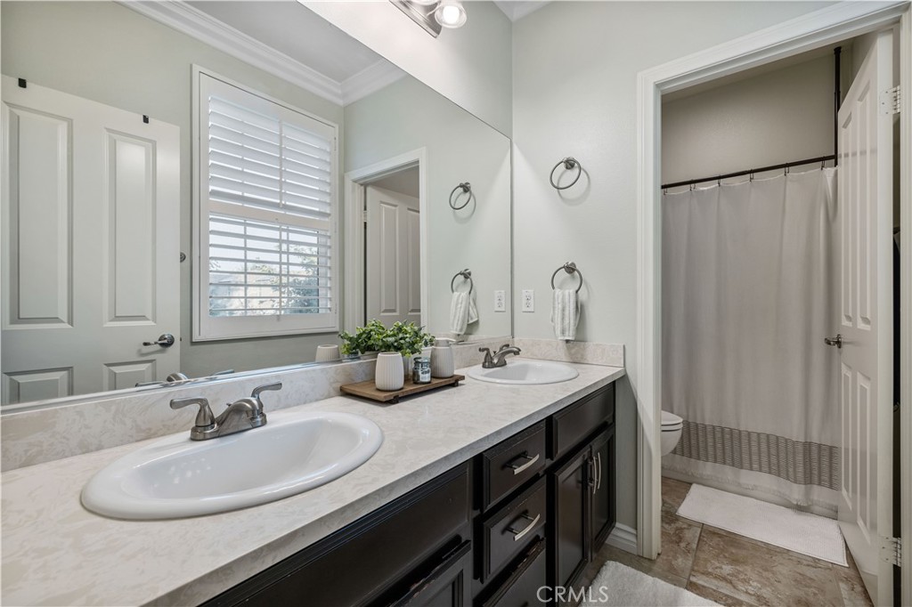 28537 Vista Del Rio Drive Valencia, CA 91354 - Photo 24 of 53 a bathroom with 2 sink and a mirror