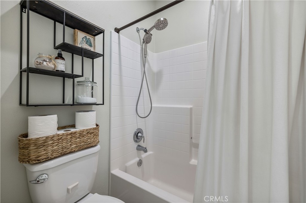 28537 Vista Del Rio Drive Valencia, CA 91354 - Photo 25 of 53 a bathroom with a granite countertop sink and a mirror