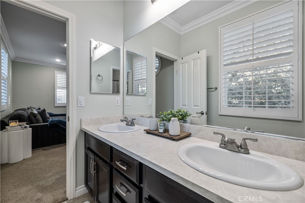 28537 Vista Del Rio Drive Valencia, CA 91354 - Photo 28 of 53 a bathroom with a sink double vanity and a mirror