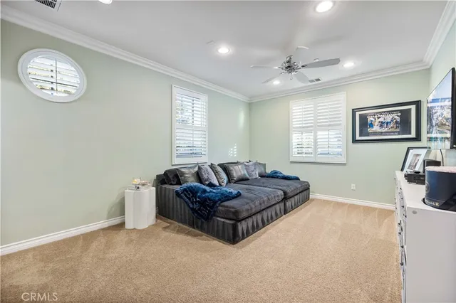 a view of a room with furniture and chandelier