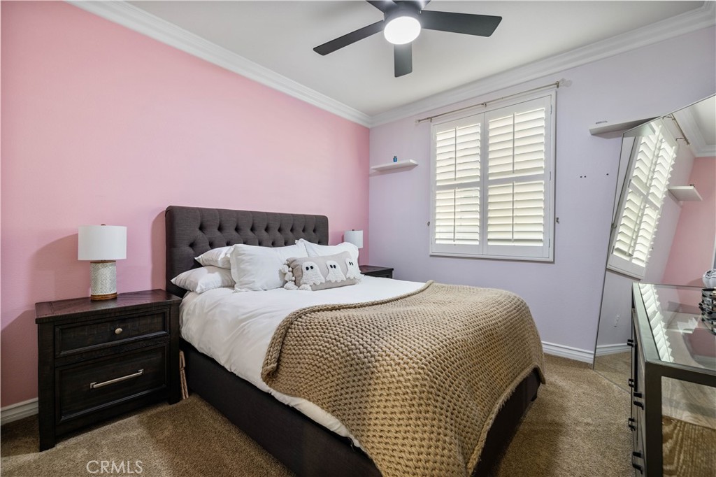 28537 Vista Del Rio Drive Valencia, CA 91354 - Photo 33 of 53 a bedroom with a bed and a chandelier