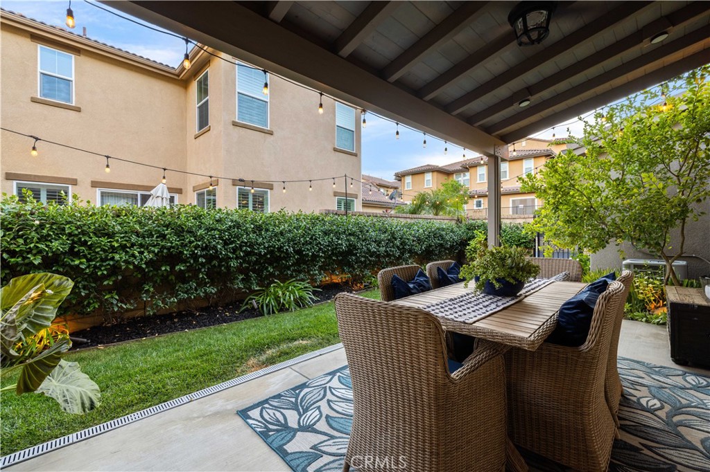 28537 Vista Del Rio Drive Valencia, CA 91354 - Photo 46 of 53 a view of a patio with table and chairs and potted plants