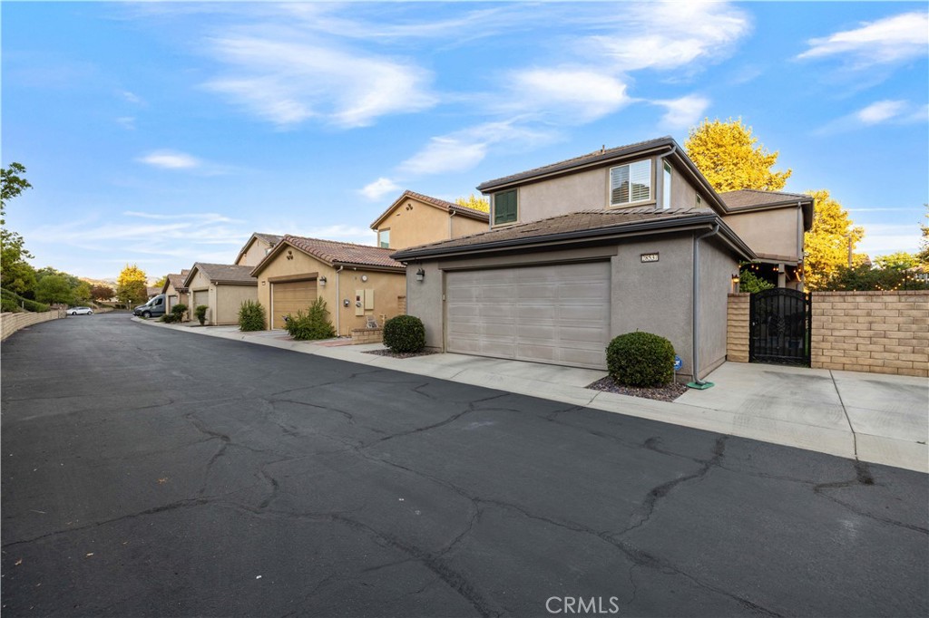 28537 Vista Del Rio Drive Valencia, CA 91354 - Photo 49 of 53 a front view of a house with a yard