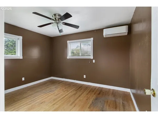 a view of room with window and ceiling fan