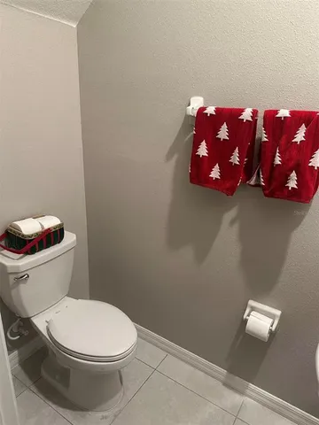 a bedroom with a bed chair and window