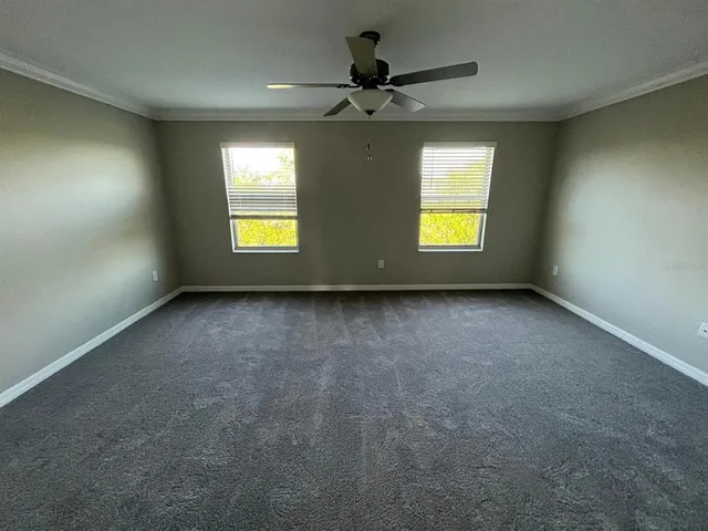 a spacious bathroom with a granite countertop sink a mirror and shower