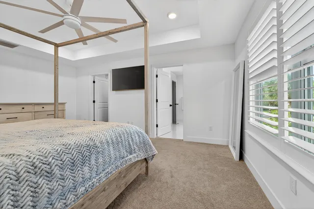 a bathroom with a shower and a plant