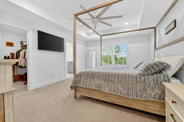 a bathroom with a sink vanity mirror and toilet