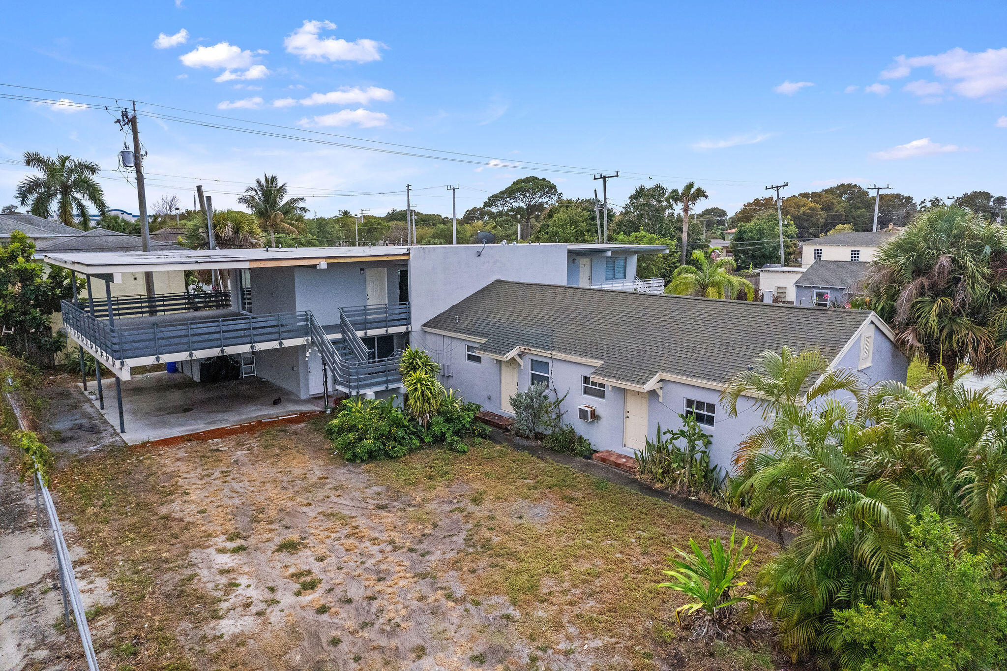 840 Almeria Road, Unit 2 West Palm Beach, FL 33405 - Photo 15 of 15 an aerial view of residential houses with outdoor space and trees