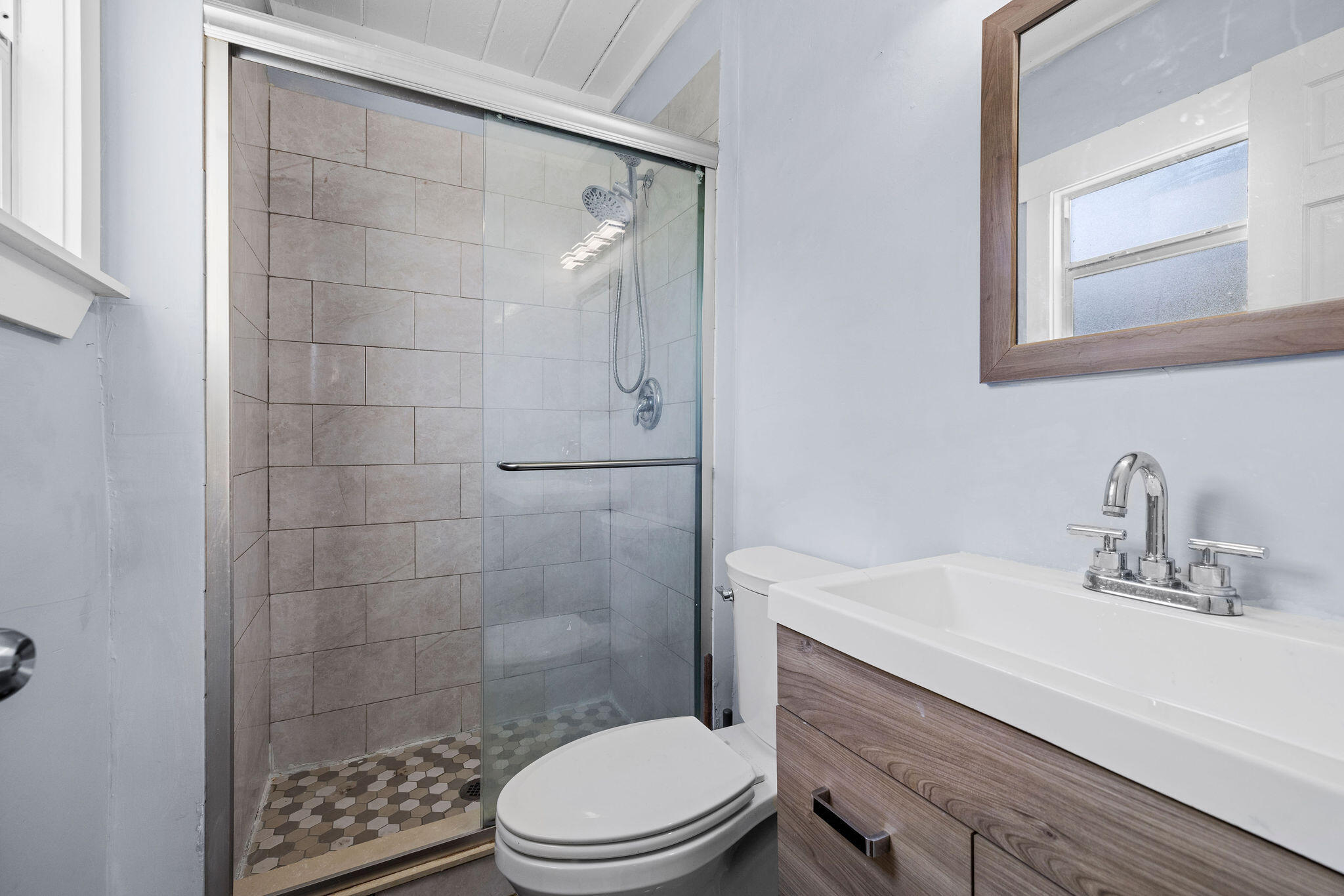 840 Almeria Road, Unit 2 West Palm Beach, FL 33405 - Photo 6 of 15 a bathroom with a sink a toilet and shower