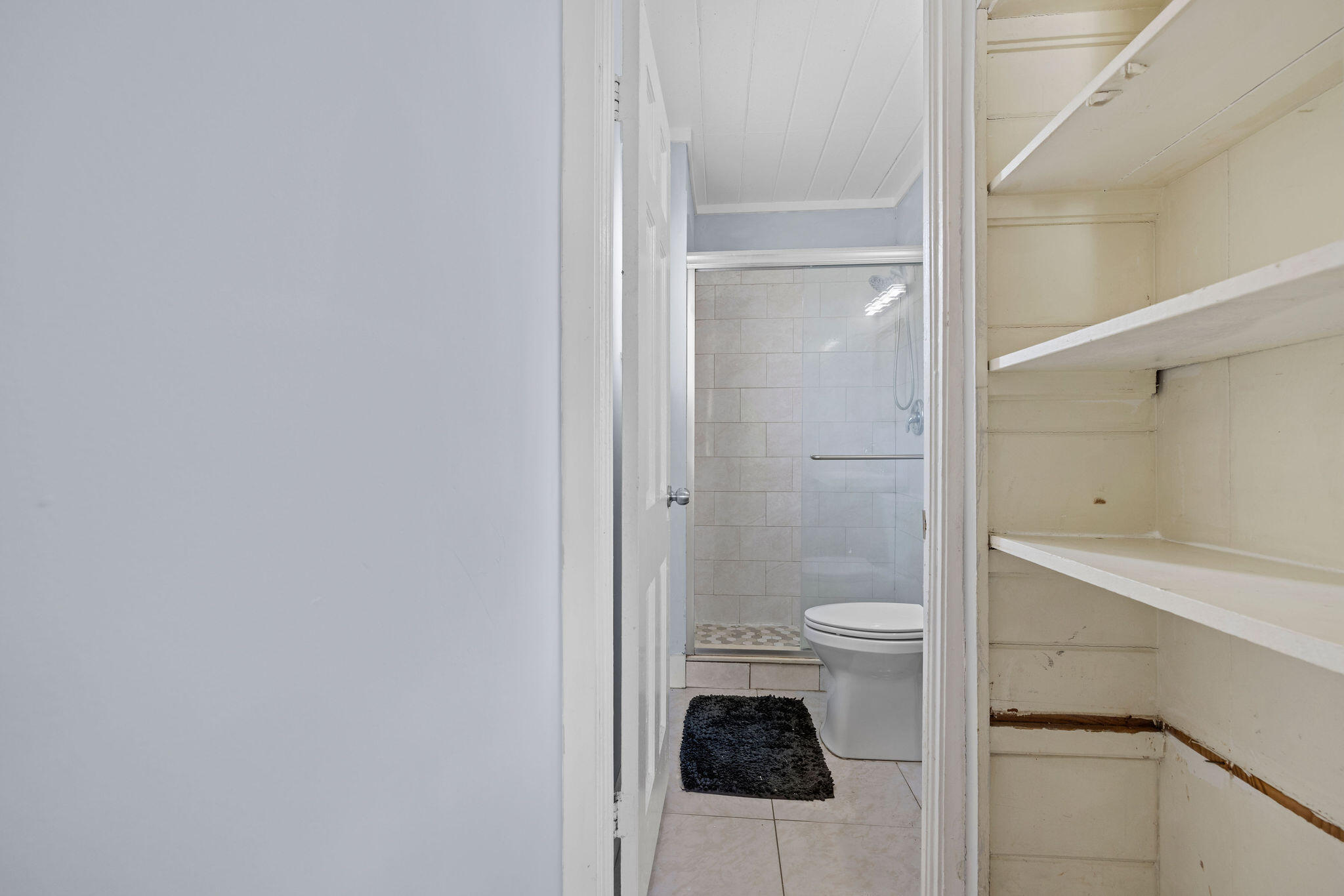 840 Almeria Road, Unit 2 West Palm Beach, FL 33405 - Photo 7 of 15 a bathroom with a toilet and a shower