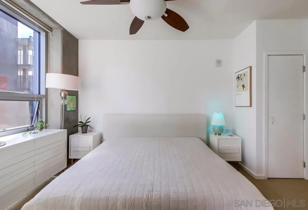 321 Tenth Avenue, Unit 903 San Diego, CA 92101 - Photo 12 of 55 a bedroom with a bed and a cabinets