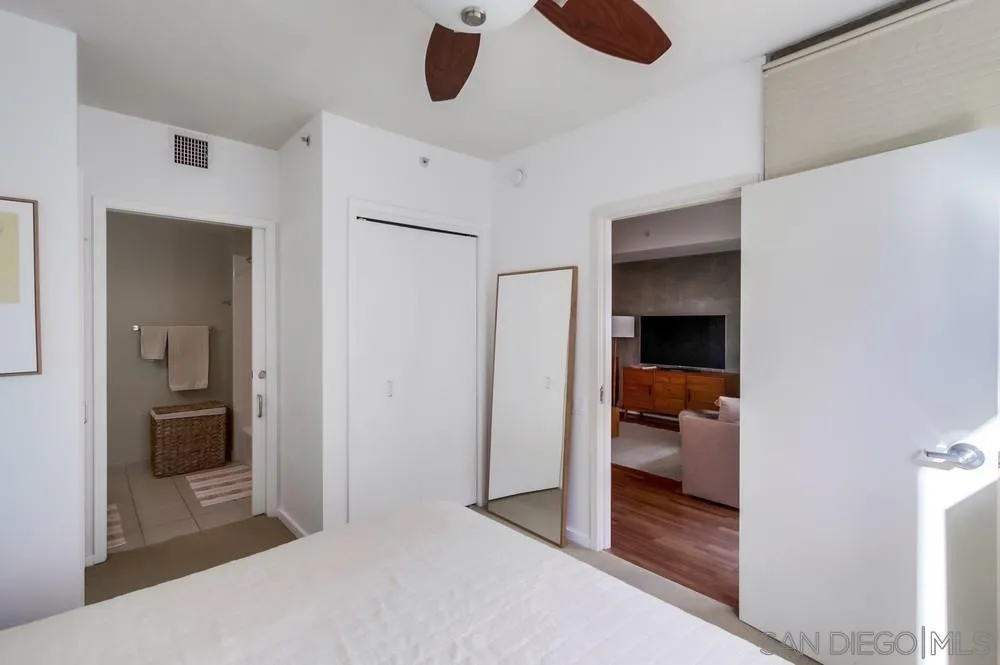 321 Tenth Avenue, Unit 903 San Diego, CA 92101 - Photo 16 of 55 a bedroom with a bed and a view of bathroom