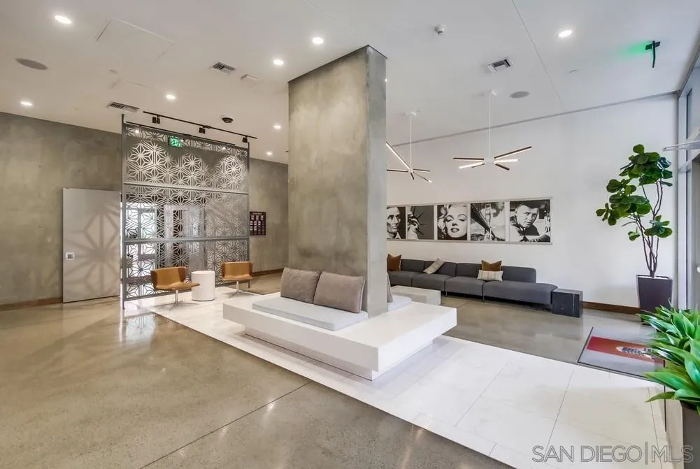 321 Tenth Avenue, Unit 903 San Diego, CA 92101 - Photo 31 of 55 a living room with furniture and a chandelier