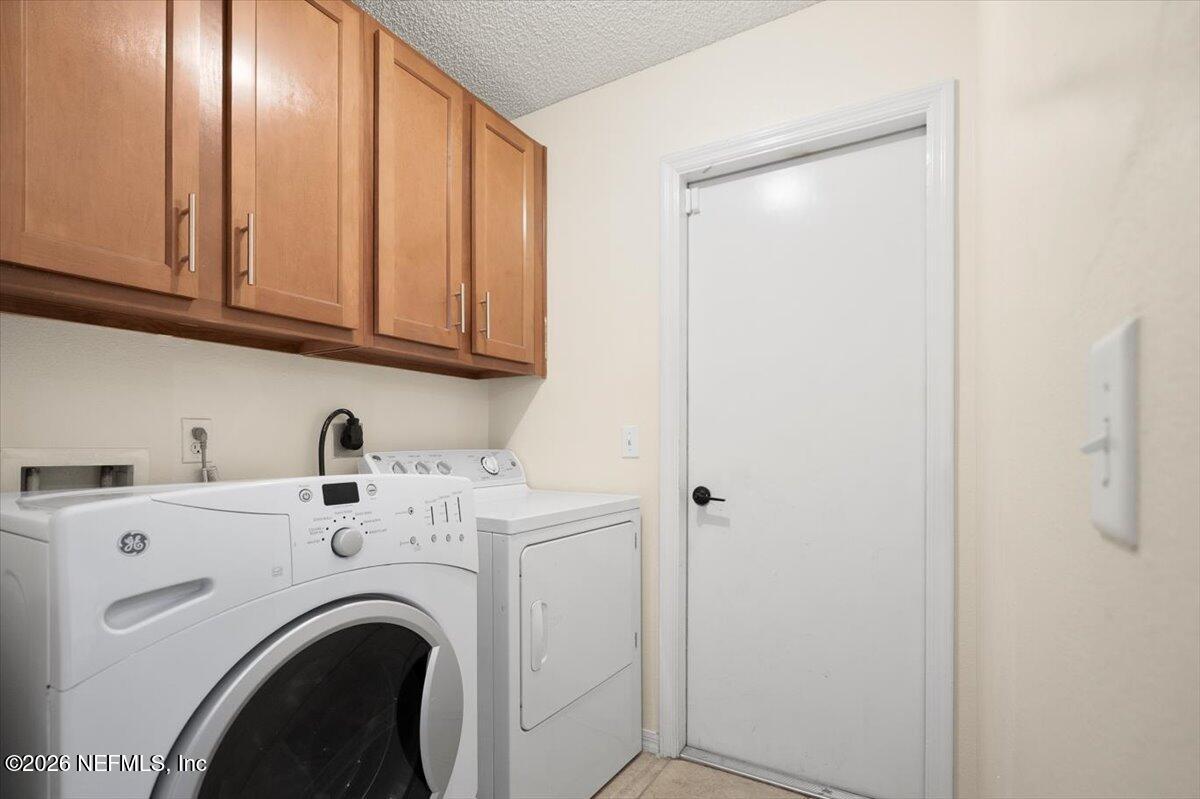 10310 Woodley Point Road Jacksonville, FL 32218 - Photo 7 of 30 a utility room with dryer and washer