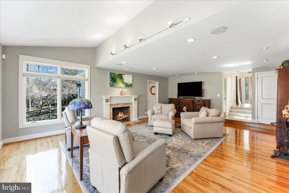 745 Hollow Road Wayne, PA 19087 - Photo 35 of 59 a living room with fireplace furniture and a floor to ceiling window