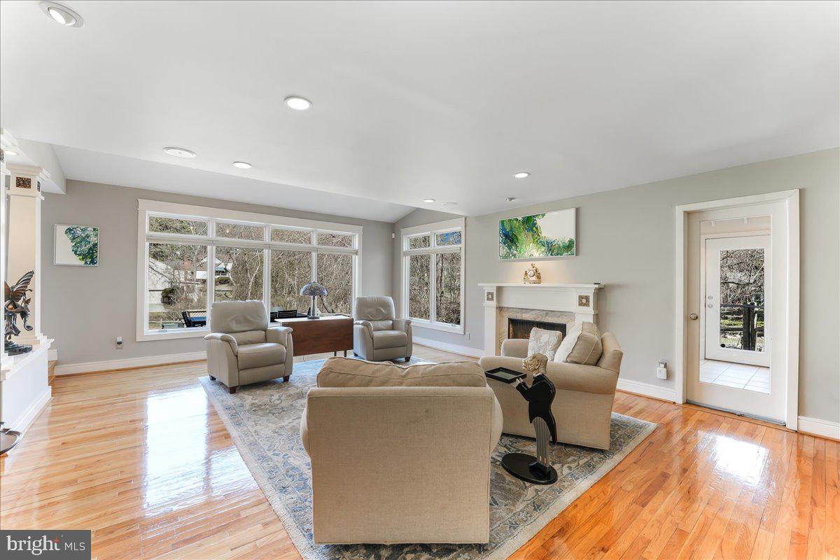 745 Hollow Road Wayne, PA 19087 - Photo 37 of 59 a living room with fireplace furniture and a wooden floor