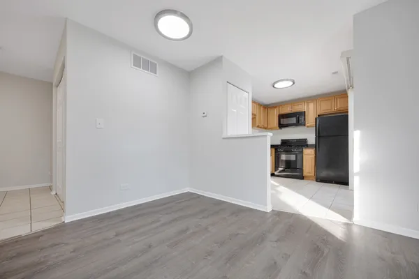 a view of kitchen with wooden floor