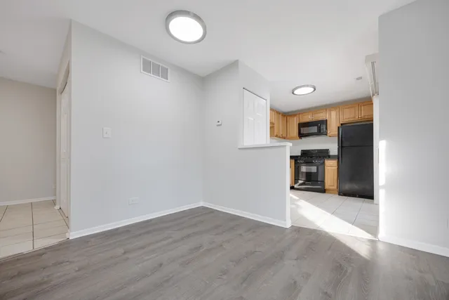 a view of kitchen with wooden floor
