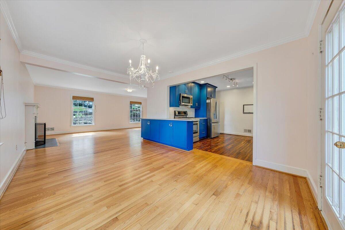 3135 West Ridge Road Southwest Roanoke, VA 24014 - Photo 12 of 50 a view of a kitchen with furniture and wooden floor
