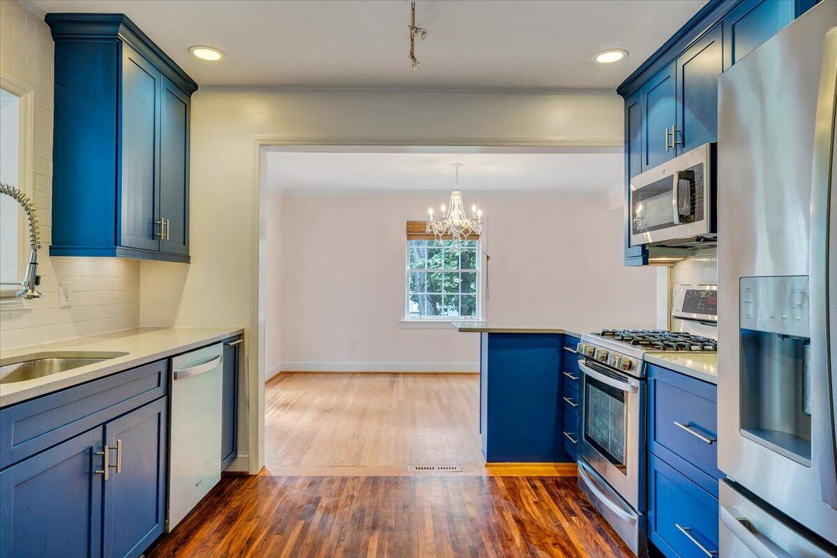 3135 West Ridge Road Southwest Roanoke, VA 24014 - Photo 15 of 50 a kitchen with stainless steel appliances granite countertop a stove a sink and a refrigerator