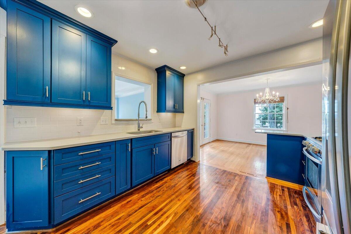 3135 West Ridge Road Southwest Roanoke, VA 24014 - Photo 16 of 50 a spacious bathroom with a granite countertop sink and a mirror