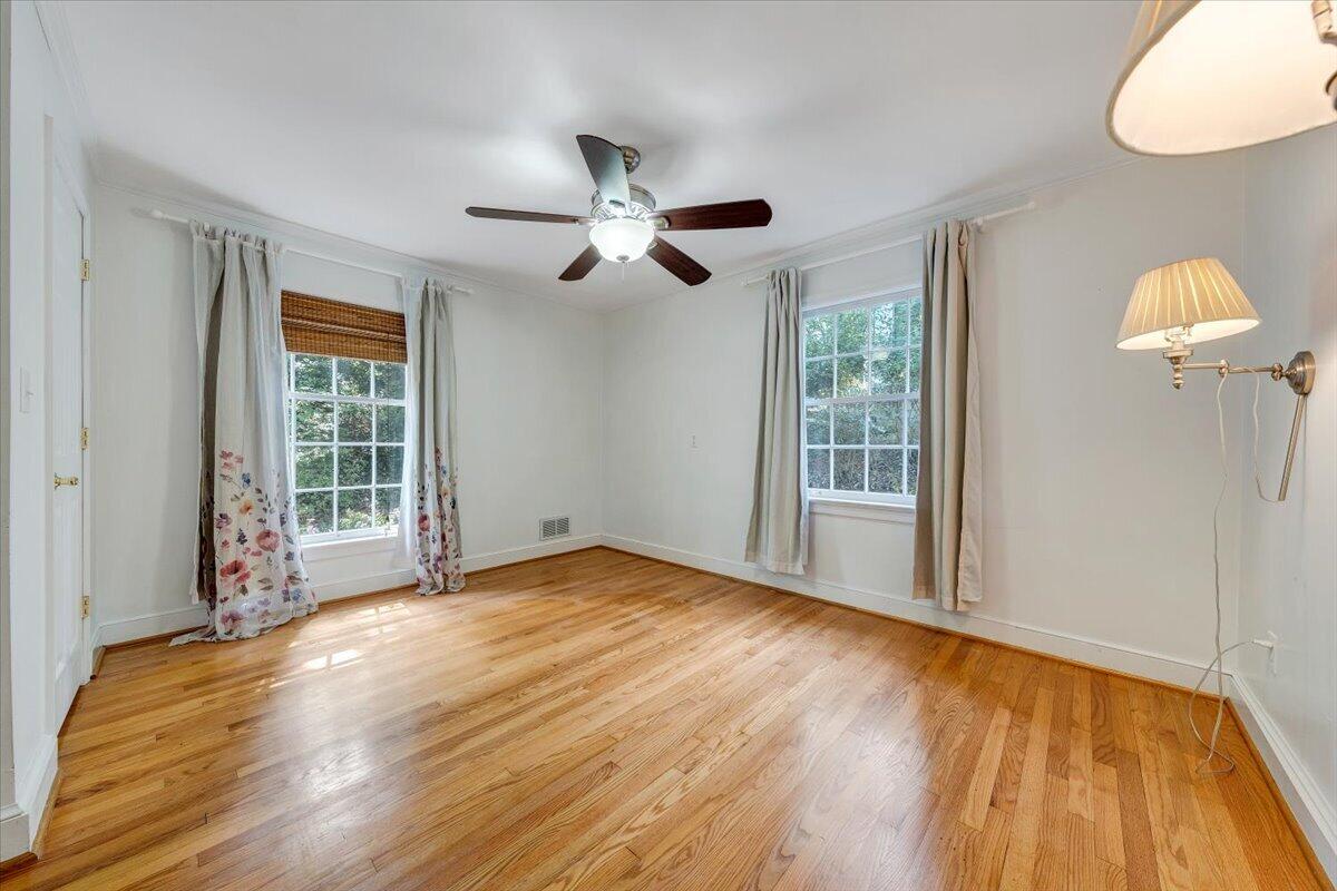 3135 West Ridge Road Southwest Roanoke, VA 24014 - Photo 23 of 50 a view of empty room with wooden floor and fan