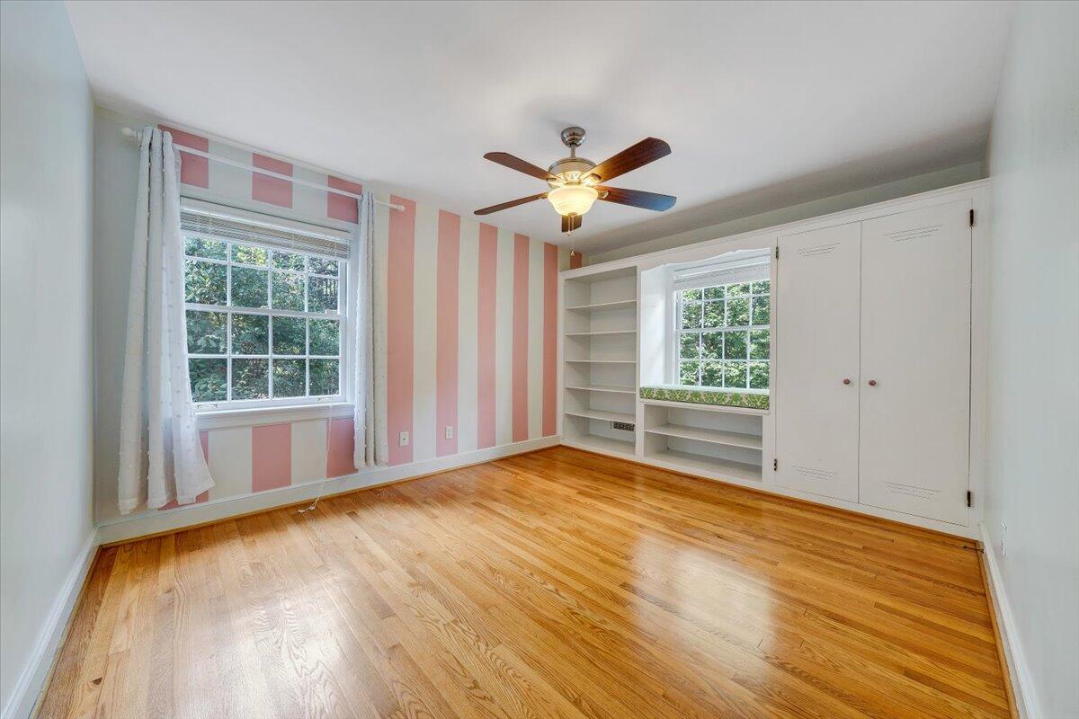 3135 West Ridge Road Southwest Roanoke, VA 24014 - Photo 25 of 50 a view of an empty room with a window and wooden floor