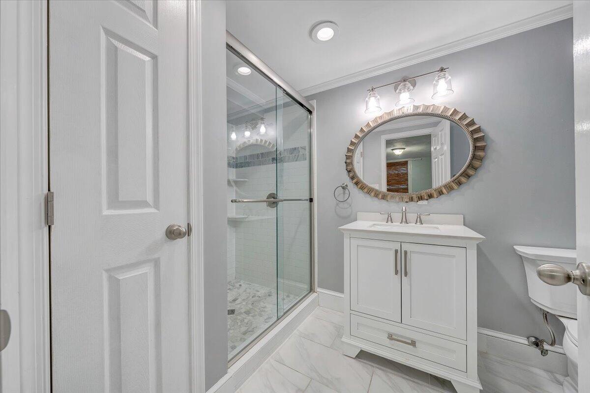 3135 West Ridge Road Southwest Roanoke, VA 24014 - Photo 28 of 50 a bathroom with a sink a toilet and shower