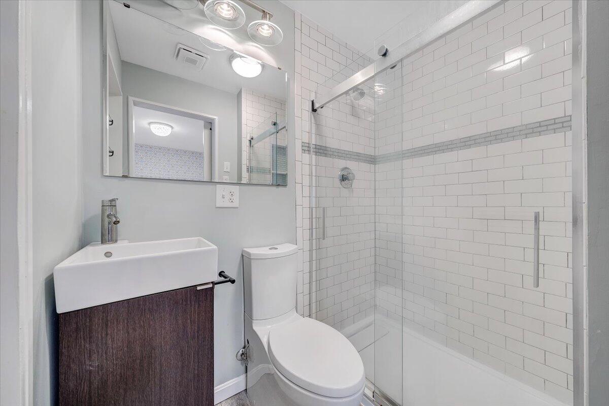 3135 West Ridge Road Southwest Roanoke, VA 24014 - Photo 29 of 50 a bathroom with a sink a toilet and shower