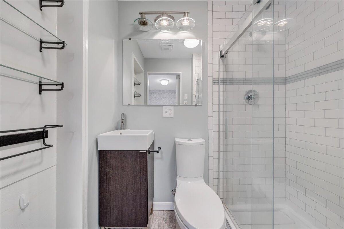 3135 West Ridge Road Southwest Roanoke, VA 24014 - Photo 30 of 50 a bathroom with a toilet a sink and shower