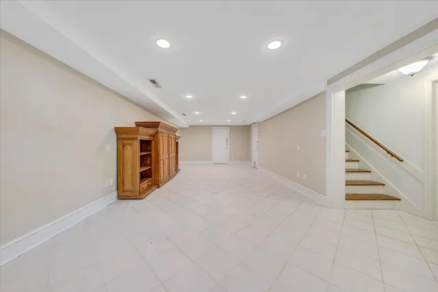 a view of an empty room with stairs