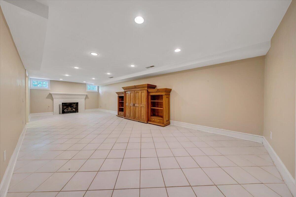 3135 West Ridge Road Southwest Roanoke, VA 24014 - Photo 33 of 50 a view of an empty room with a fireplace and a window