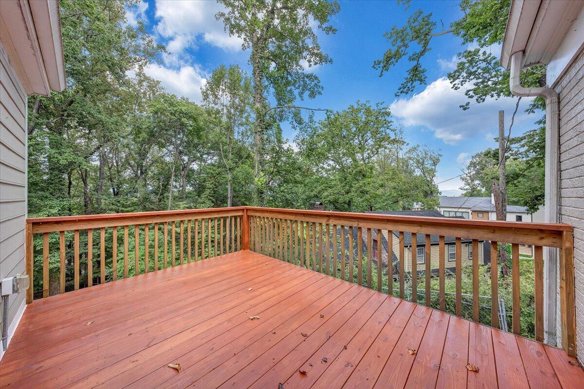 3135 West Ridge Road Southwest Roanoke, VA 24014 - Photo 39 of 50 a balcony with wooden floor and fence