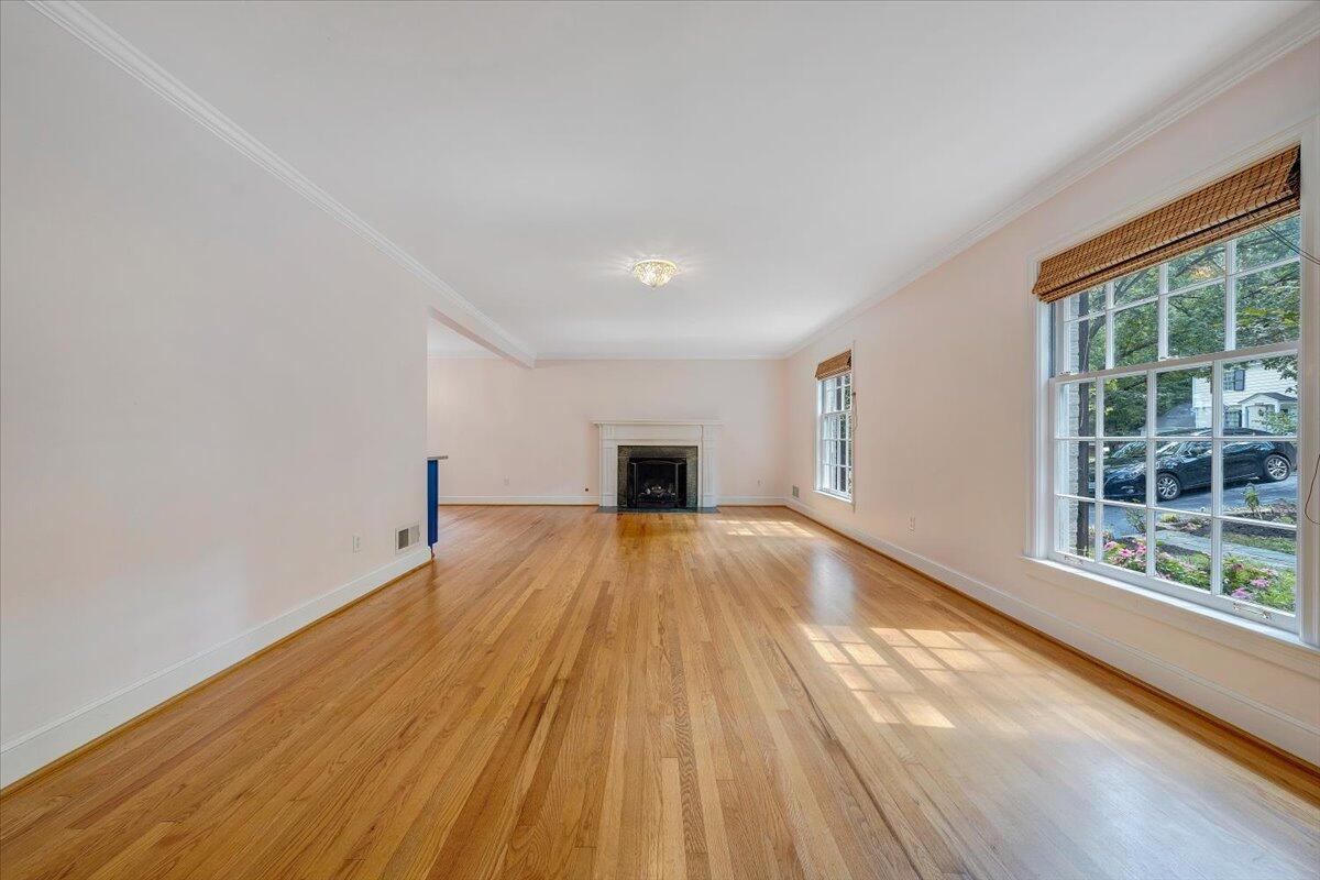 3135 West Ridge Road Southwest Roanoke, VA 24014 - Photo 4 of 50 a view of empty room with wooden floor and fireplace