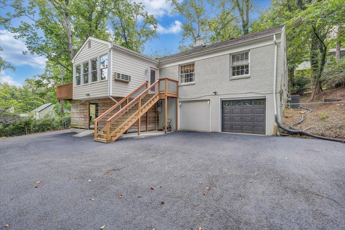 3135 West Ridge Road Southwest Roanoke, VA 24014 - Photo 41 of 50 a view of a house with a yard and a large tree