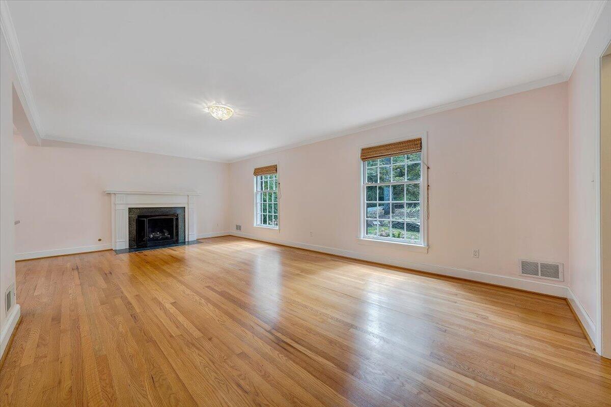 3135 West Ridge Road Southwest Roanoke, VA 24014 - Photo 6 of 50 a view of an empty room with wooden floor and a window