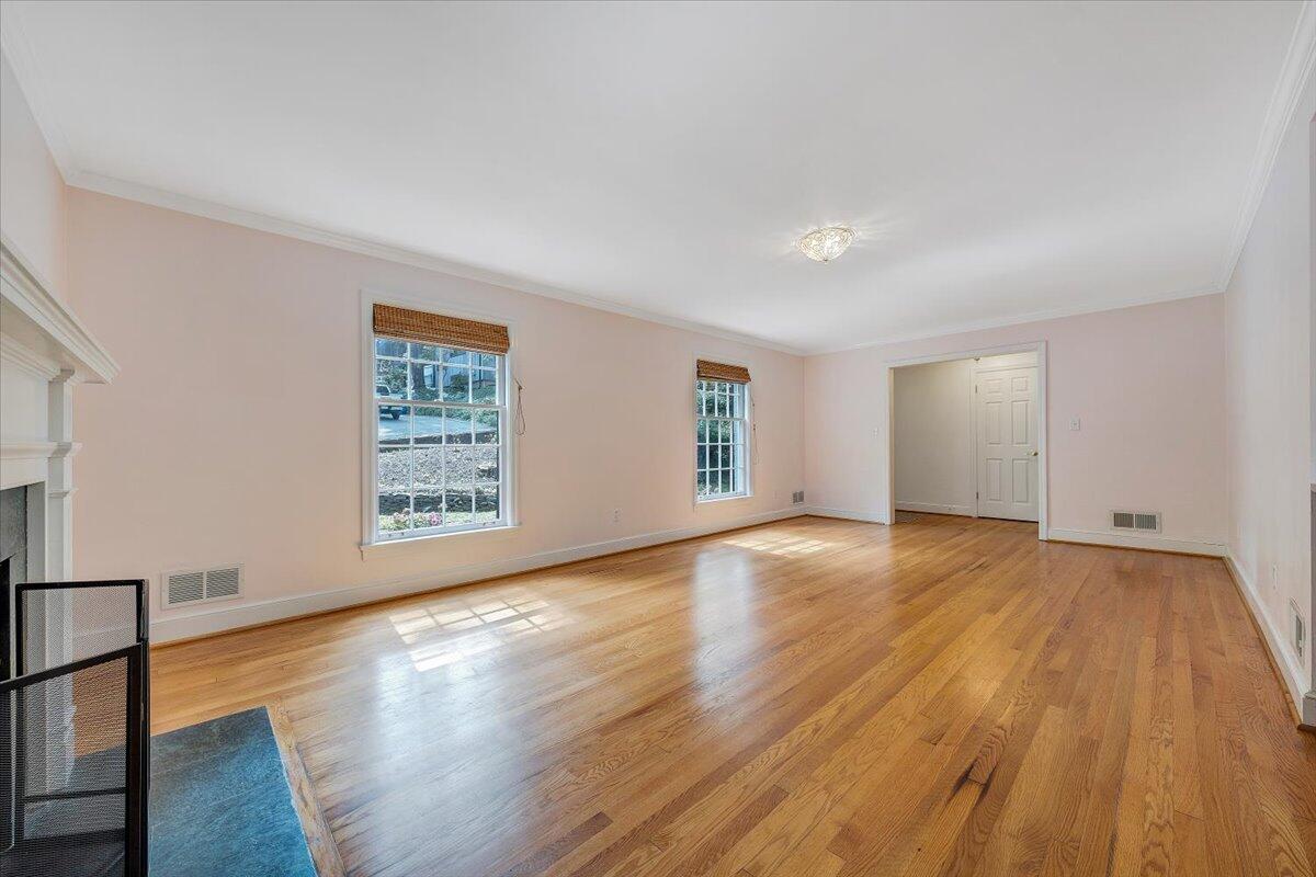 3135 West Ridge Road Southwest Roanoke, VA 24014 - Photo 8 of 50 a view of an empty room with wooden floor and a window