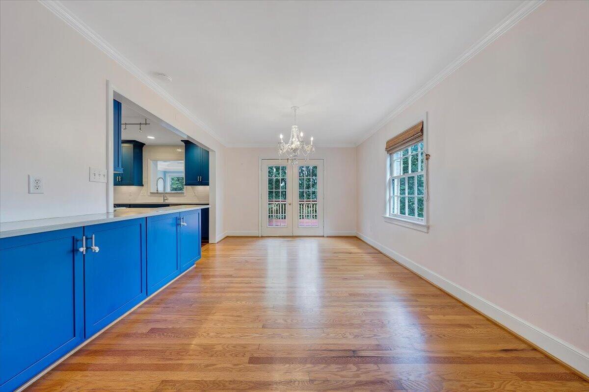 3135 West Ridge Road Southwest Roanoke, VA 24014 - Photo 10 of 50 a view of an empty room with window and wooden floor