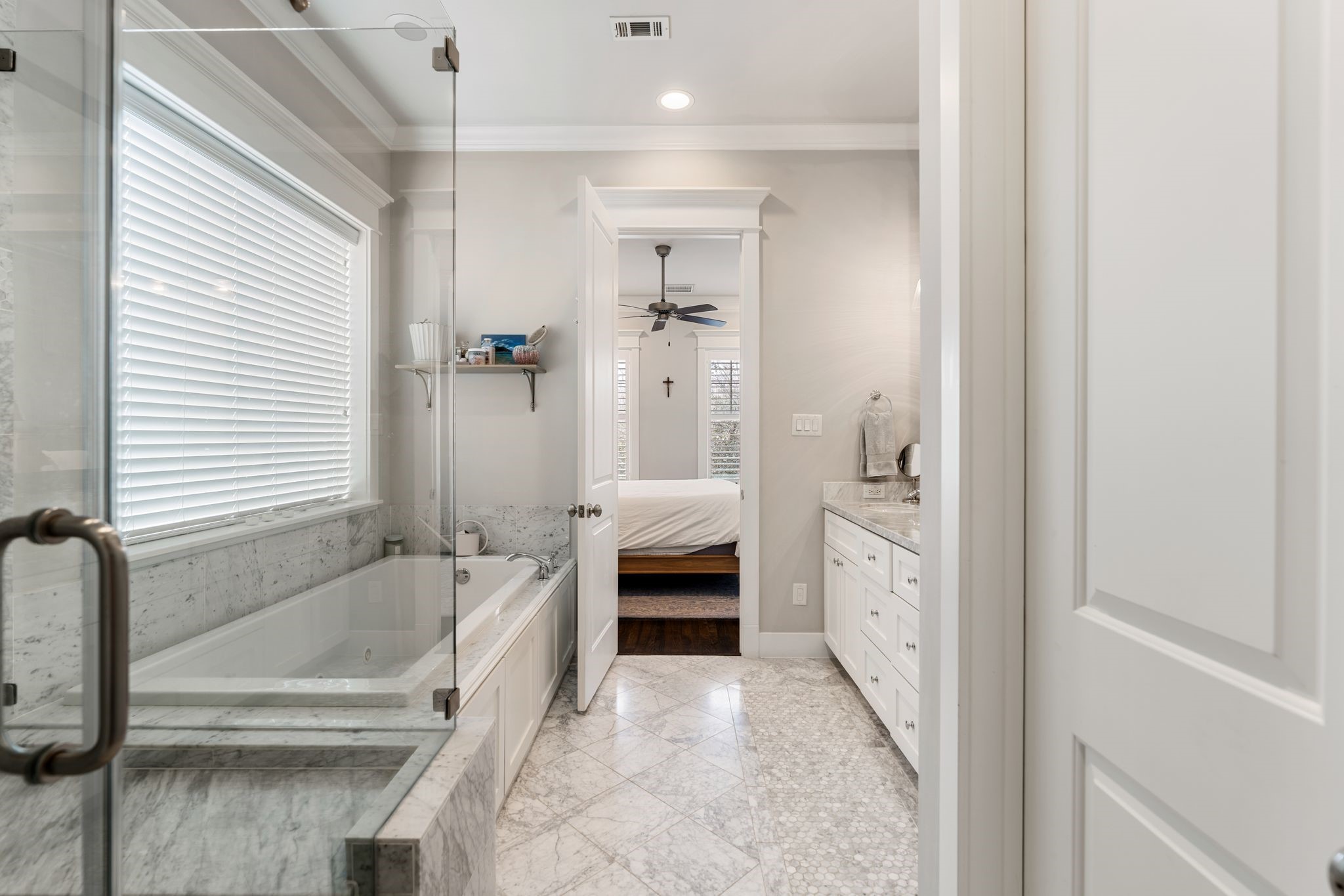 924 Aurora Street Houston, TX 77009 - Photo 24 of 37 Appointed with marble finishes, the primary bathroom feels elevated and timeless.