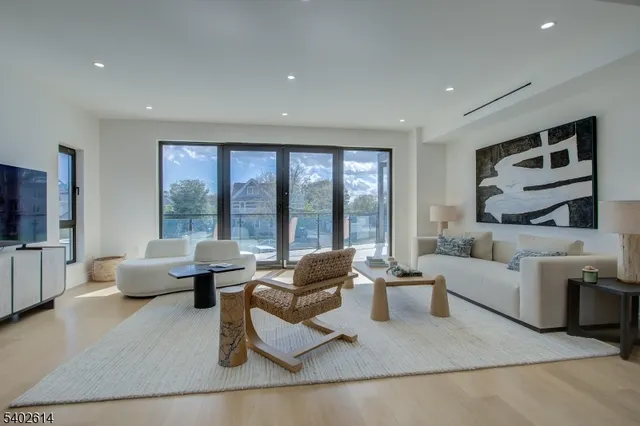 a living room with furniture and large window