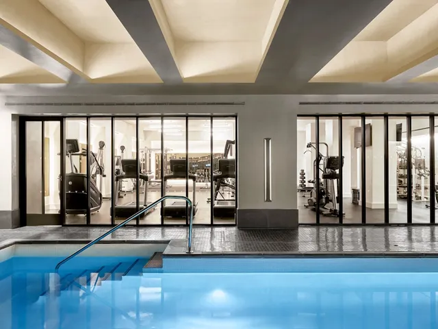a view of gym equipment with floor to ceiling windows