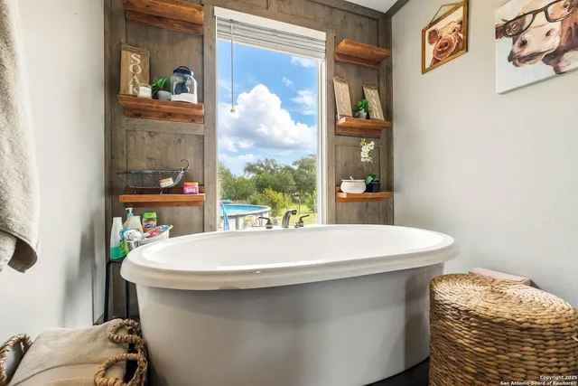 a bedroom with furniture and a window