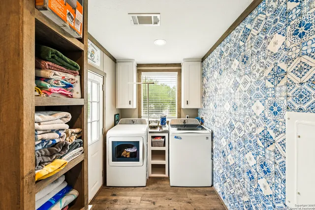 a kitchen with stainless steel appliances granite countertop a stove and cabinets