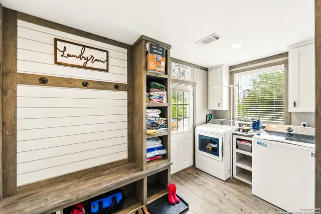 a view of a swimming pool and lounge chairs in back of the house