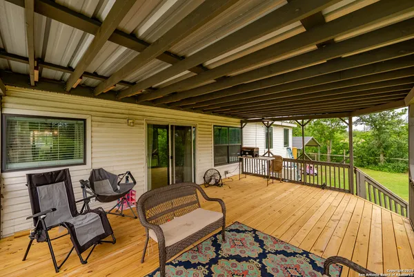 a view of a swimming pool and trees in the background