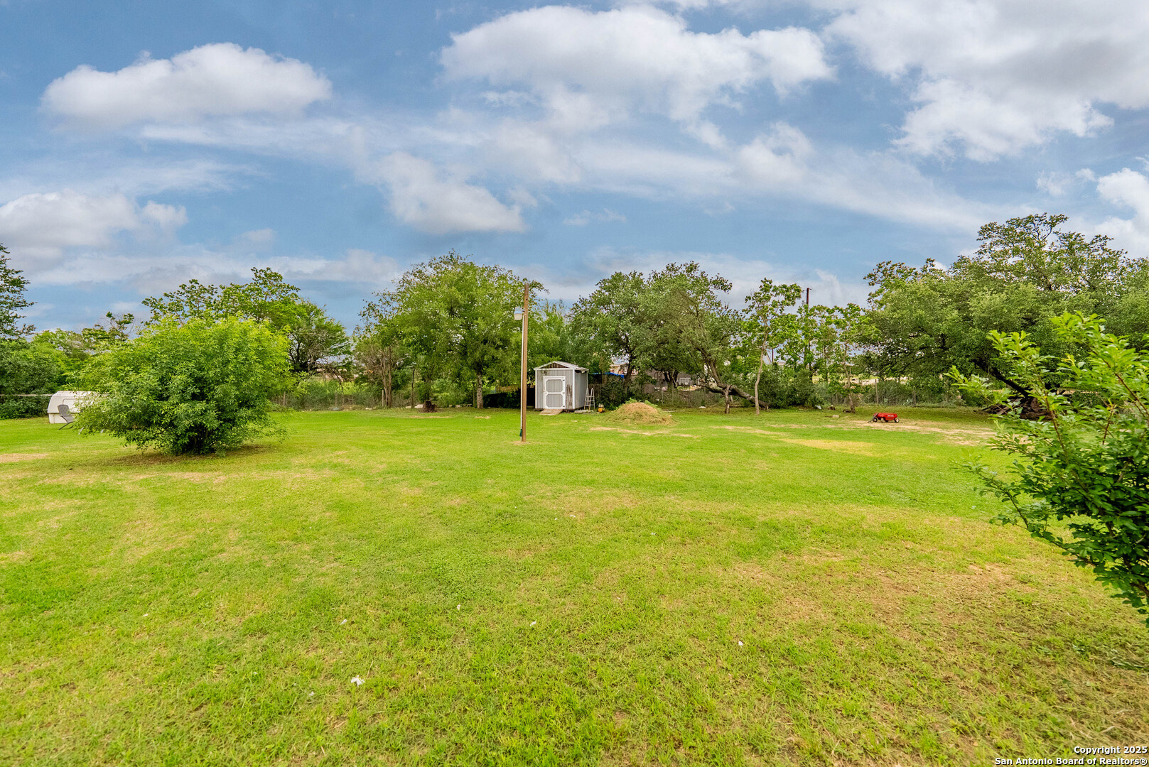 238 Las Palomas Drive Lytle, TX 78052 - Photo 23 of 25 a view of swimming pool with an outdoor space and seating area
