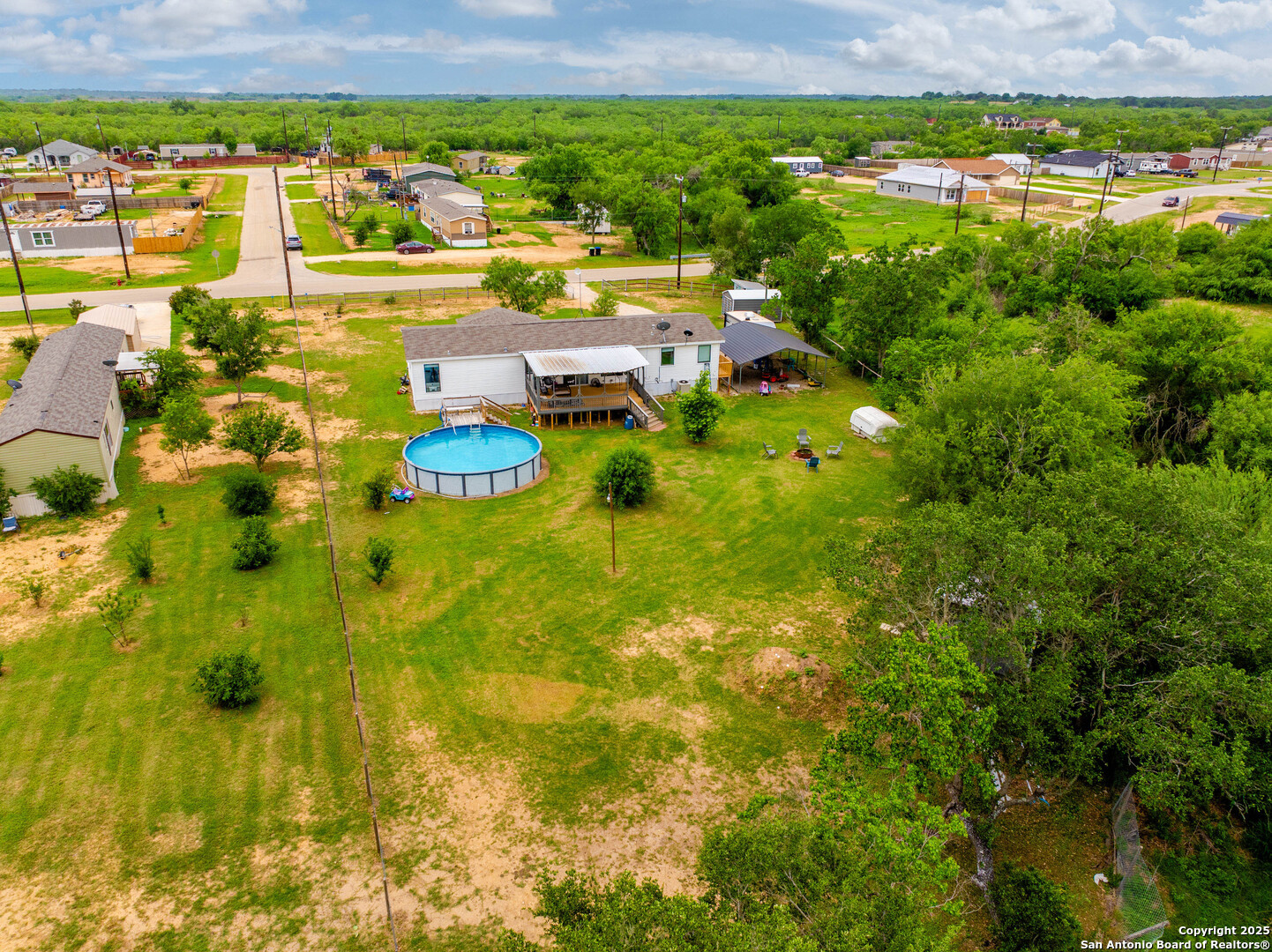 238 Las Palomas Drive Lytle, TX 78052 - Photo 25 of 25 a view of a lake with a city