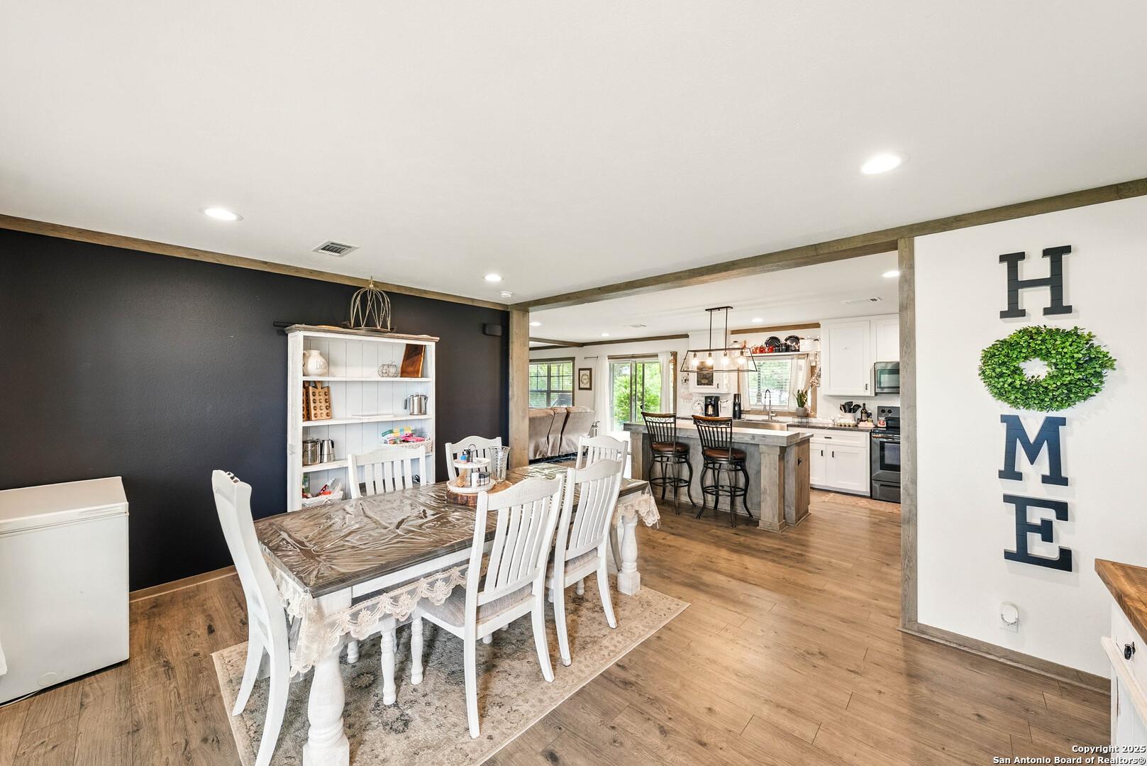 238 Las Palomas Drive Lytle, TX 78052 - Photo 4 of 25 a view of a dining room with furniture and wooden floor
