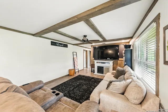 a kitchen with refrigerator a sink and chairs